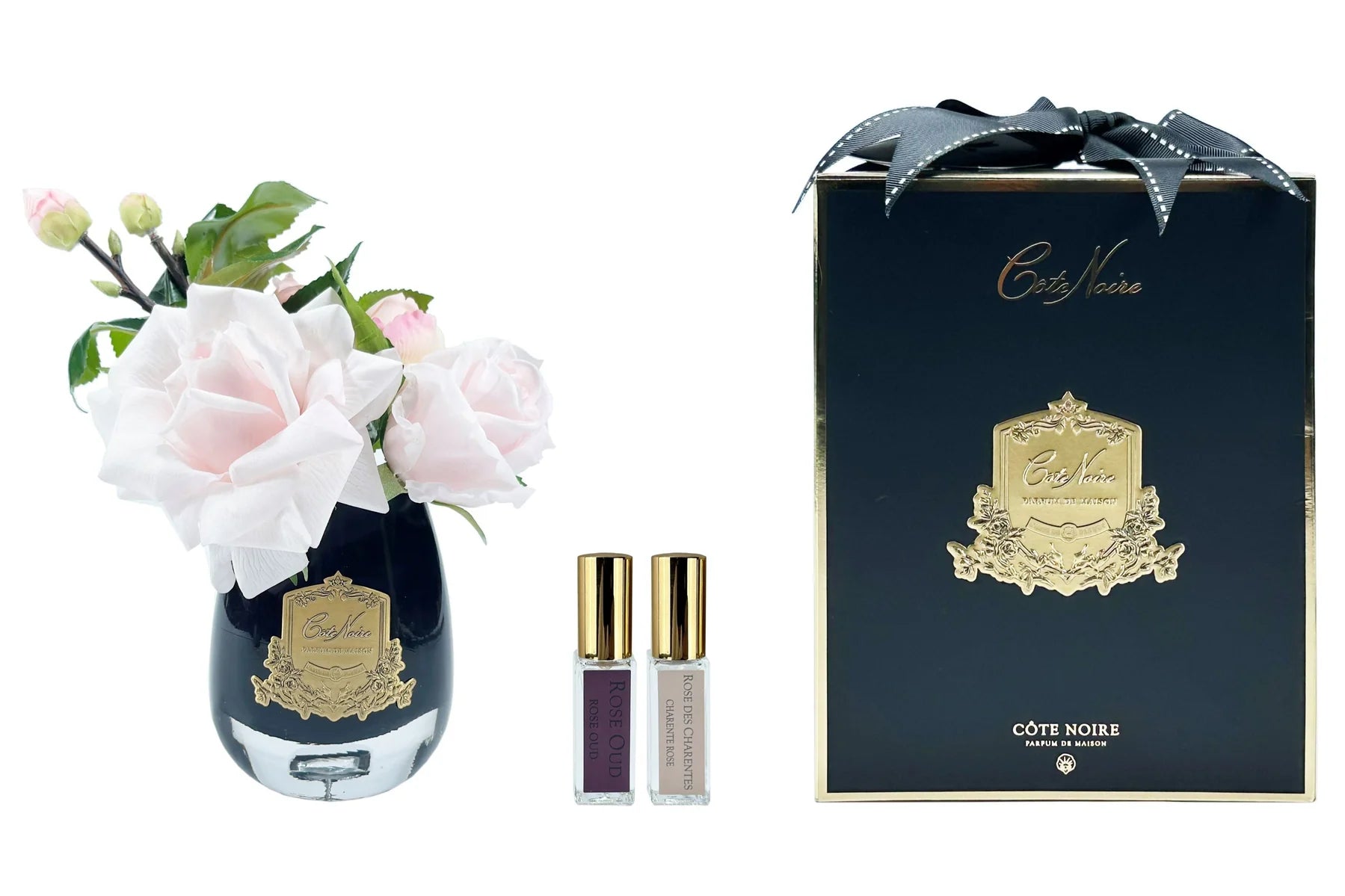 Pink tea rose in a black glass diffuser