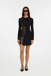 Black mini dress with long sleeves and sequin side detail