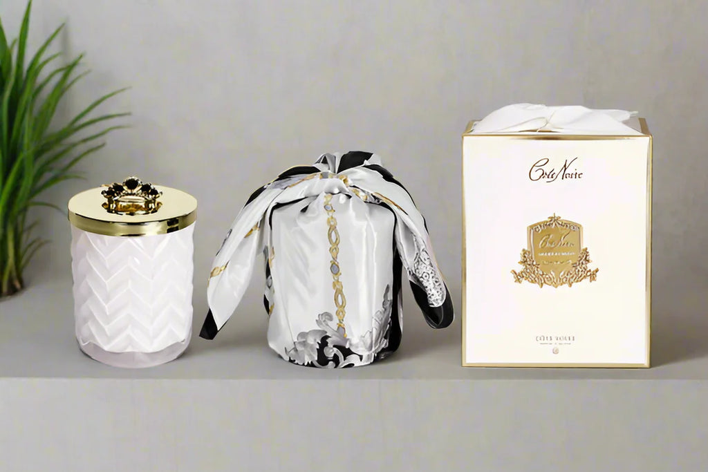 White herringbone candle with scarf and crown broach prosecco fragrance