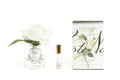 Ivory single rose in a clear glass diffuser