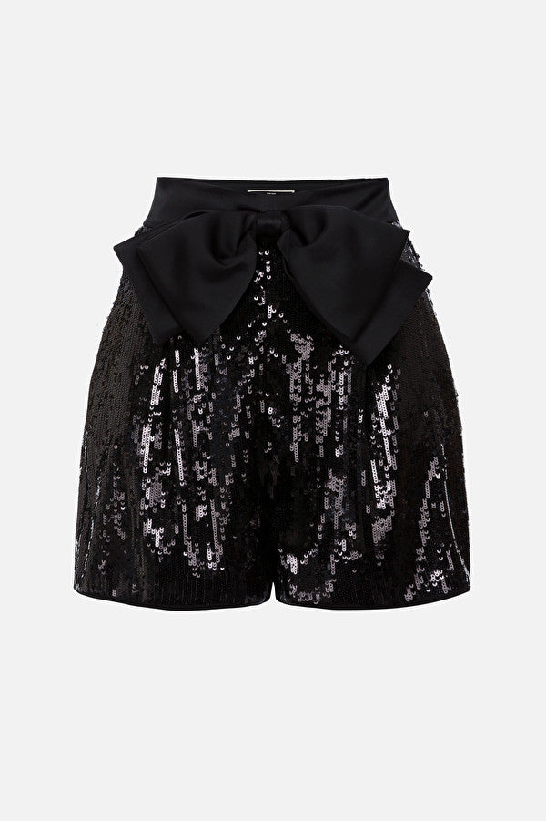 Black sequin shorts with a bow