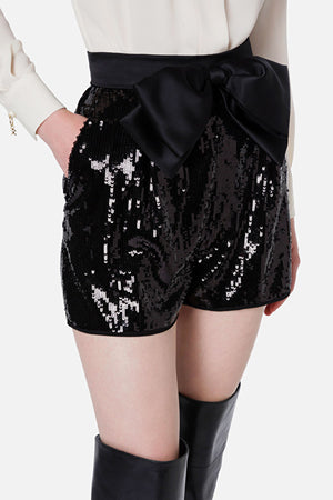 Black sequin shorts with a bow