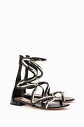 flat gladiator sandals in black and gold